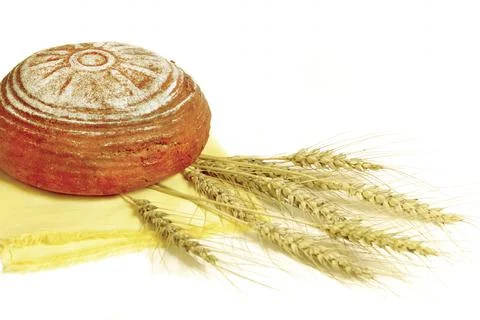 Rye bread and ears of rye on a white background. selective focus Stock Photos