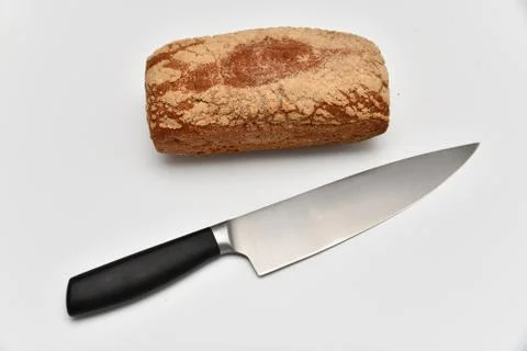 Rye bread and kitchen knife isolated on white background 스톡 사진