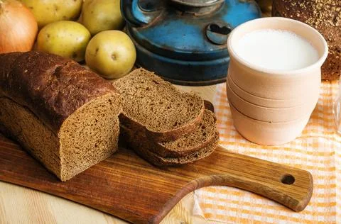 Rye bread and milk on the table Stock Photos