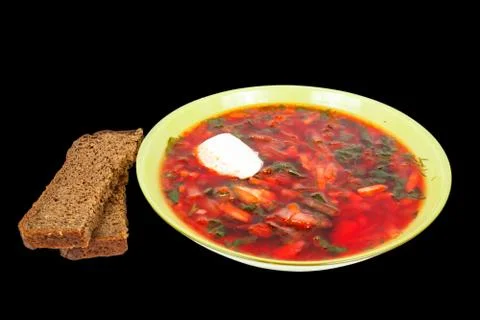 Rye bread and a plate with borsch Stock Photos