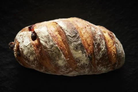 Rye bread on a black background Stock Photos