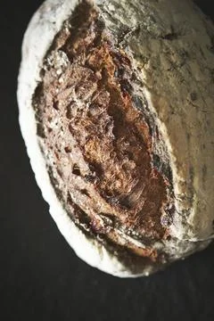 Rye bread on a black background Stock Photos