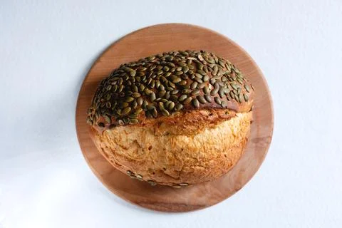 Rye bread on a board on a white tablecloth background Stock Photos