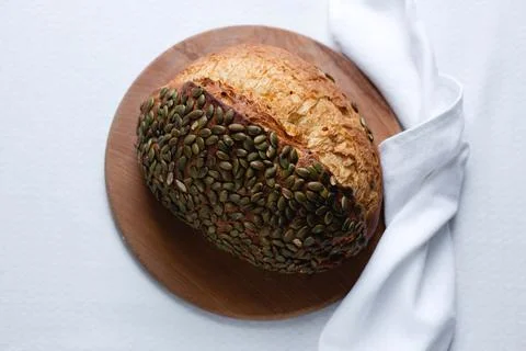 Rye bread on a board on a white tablecloth background Stock Photos