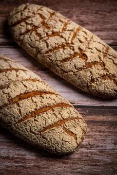 Rye bread on brown background 스톡 사진