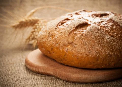 Rye bread on burlap background Stock Photos