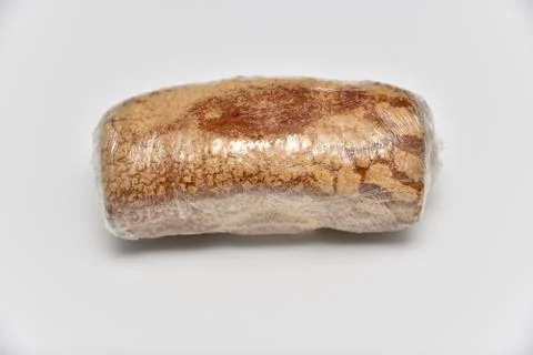 Rye bread in cellophane isolated on white background Stock Photos