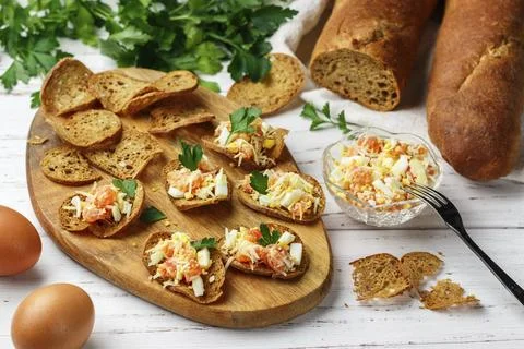 Rye bread chips. A delicious snack of whole-grain slices bread with seeds and a Stock Photos