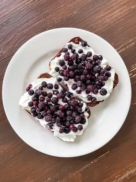 Rye bread with cottage cheese and blueberries Stock Photos