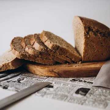 Rye bread cut into slices on a white background Stock Photos
