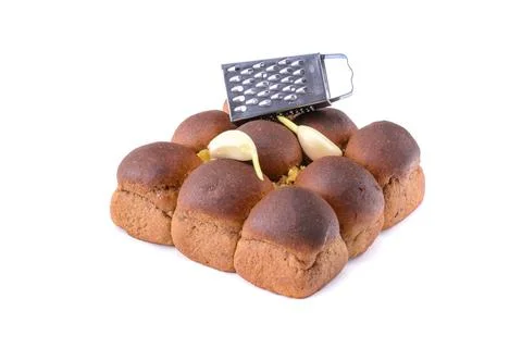 Rye bread with garlic is isolated on a white background, selective focus. Stock Photos