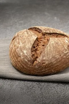 Rye bread on a grey napkin on a grey marble background Stock Photos