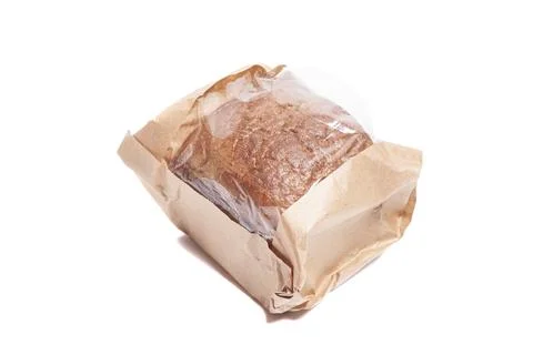 Rye bread in a paper bag isolated on white background. Stock Photos