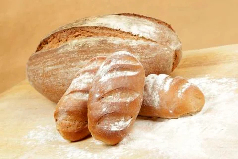 Rye bread rolls on a breadboard Foto stock