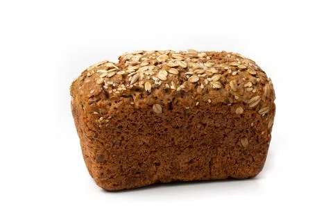 Rye bread round loaf bread with cereals oat flakes, seeds on a white backgrou Stock Photos