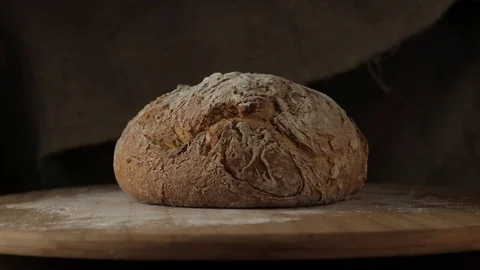 Rye bread of round shape on a wooden backing Stock Footage 95530440