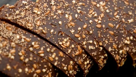 Rye bread with seeds, side view. Video stock 165557358