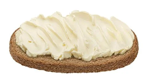 Rye bread slice with butter spread isolated on white background Stock Photos