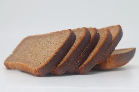 Rye bread slice isolated on white background. Stock Photos