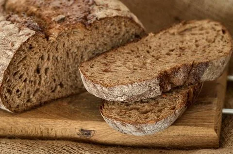 Rye bread sliced or cut on wooden board Stock Photos