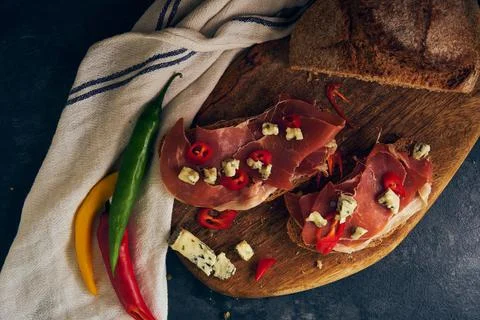 Rye bread with slices of jamon and cheese Stock Photos