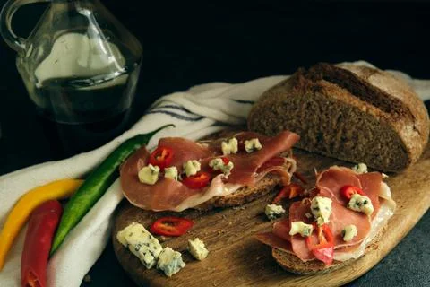 Rye bread with slices of jamon and cheese 스톡 사진