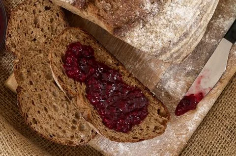 Rye bread slices spread with fruit jam it top view close-up Stock Photos