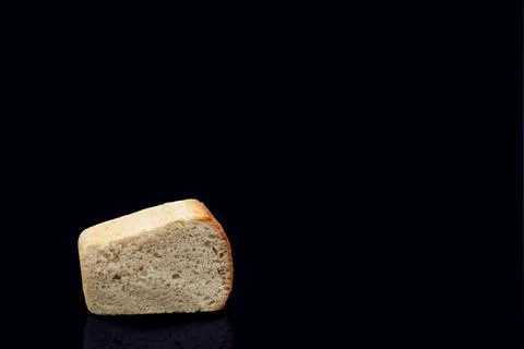 Rye bread on sourdough on a dark background in the section. Illustrazione stock