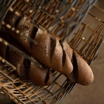 Rye bread. Three dark baguettes. Healthy grain bread. Fresh baked goods concept Stock Photos