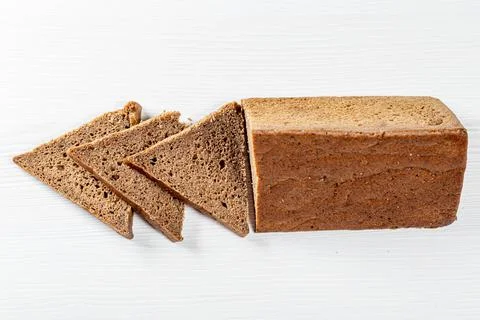 Rye bread triangular shape on white background Stock Photos