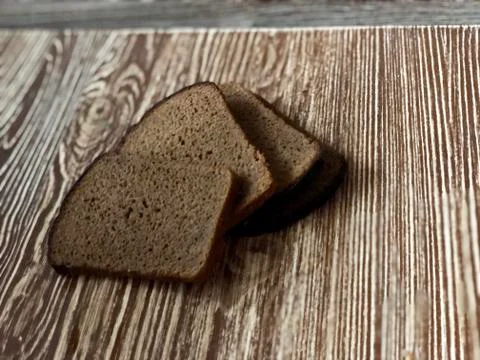 Rye bread on the wooden table Stock Photos