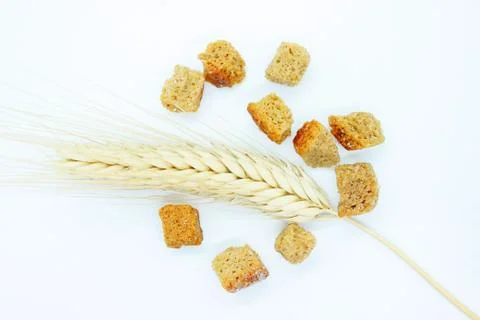Rye crackers and rye spike located on a white background Stock Photos
