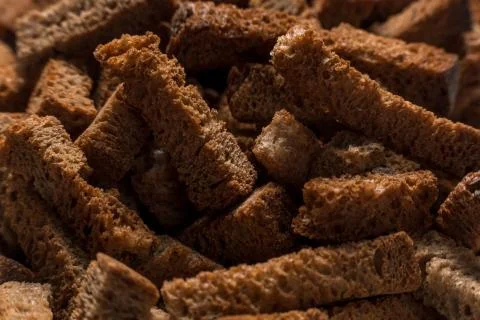 Rye crackers on green marble background close-up Stock Photos