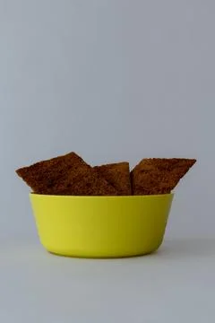Rye Crispbread Snacks in Yellow Plastic Bowl  Healthy Food Stock Photos