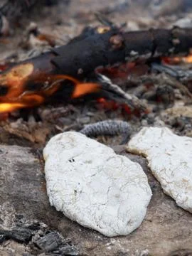 Rye flatbread on the fire Stock Photos