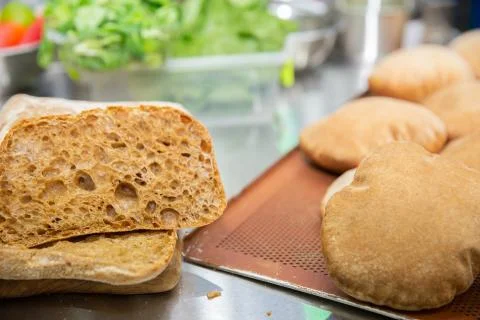 The Rye fresh bread on kitchen background. Stock Photos
