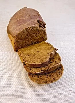 Rye homemade bread on rough bagging Stock Photos