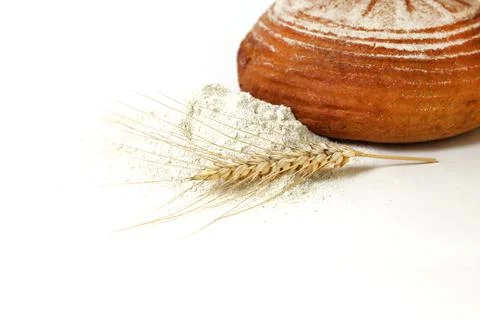 Rye round bread, ear and rye flour on a white isolated background. Harvest co Stock Photos