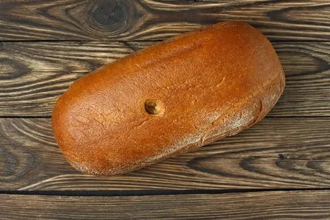 Rye round bread on a wooden table 스톡 사진