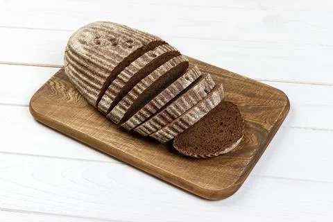 Rye sliced bread on the white table Stock Photos