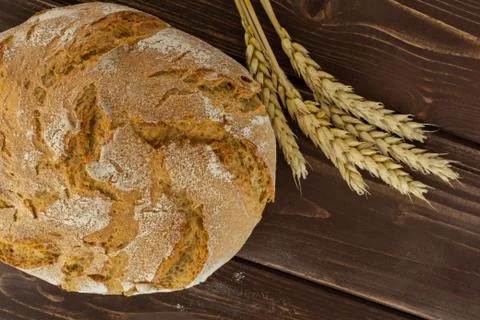 Rye wheat bread on brown wood Stock Photos