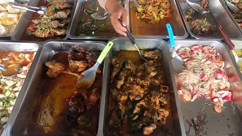 Rying chicken legs in a pan close up Stock Footage 176467197