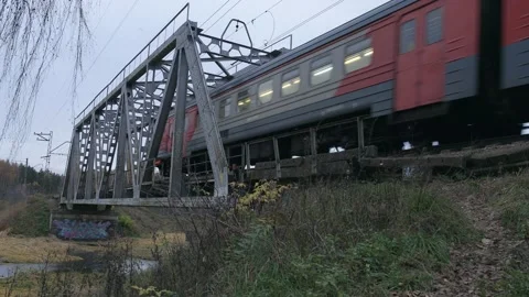 RZD suburban train is crossing the small bridge over water Stock Footage 150433485