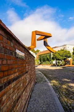 Rzezba Piastowska sculpture and brick wall located on Tumski Island, Poland. Stock Photos