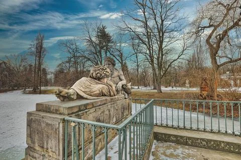 Rzezba rzeki Bug sculpture and scattered snow under in Lazienki Krolewskie Park Stock Photos