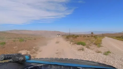RZR Dune buggy drives through Las Vegas desert Stock Footage 111882098