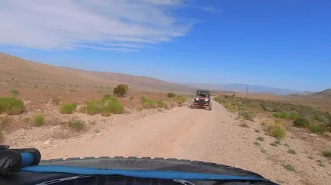 RZR Dune buggy drives through Las Vegas desert Stock Footage 111882180