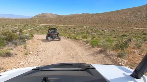 RZR Dune buggy drives through Las Vegas desert Stock Footage 112302869
