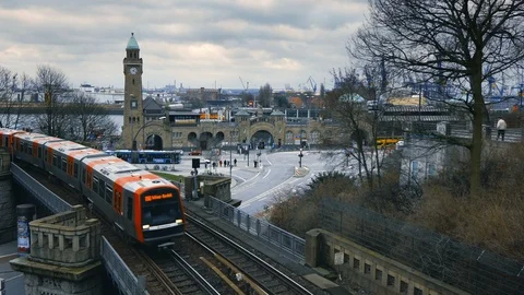 S-bahn train coming on the railway, Elbe port in the background, Clocktower at S Stock Footage 102280685