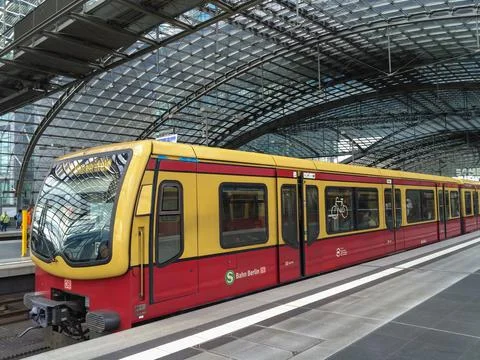 S-Bahn train at the platform in the main station of Berlin, Germany. Stock Photos